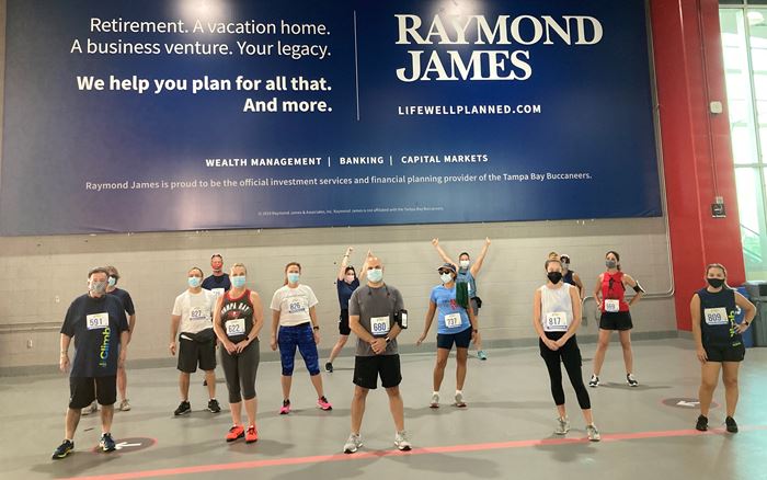 Raymond James associates pose at Raymond James Stadium at the 2021 Fight for Air Climb